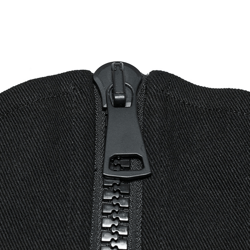 Close-up of an oversized black zipper on a punk minimalist corset, showcasing bold design details.