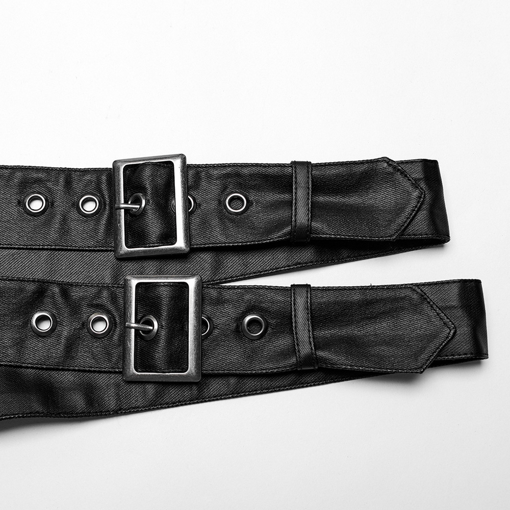 Close-up of black punk harness straps with silver buckles and eyelets, showcasing the edgy design details.