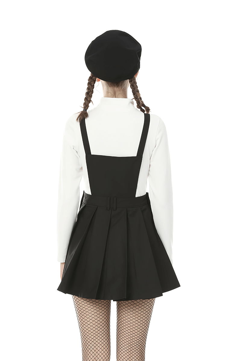 Back view of a woman wearing a black suspender dress with a white top and beret, showcasing a chic punk style.