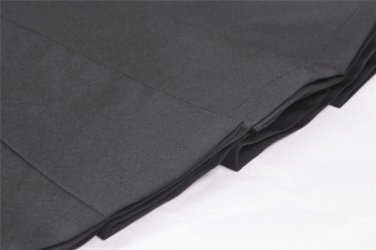 Close-up of soft, dark fabric showcasing the stylish stitching of a Punk Pentagram Suspender Dress.