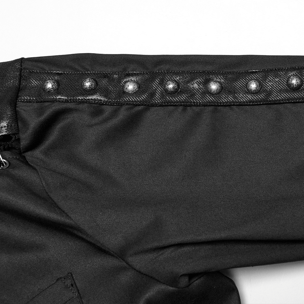 Close-up of punk men's shirt sleeve featuring eyelet details and iron rings for a gothic look.