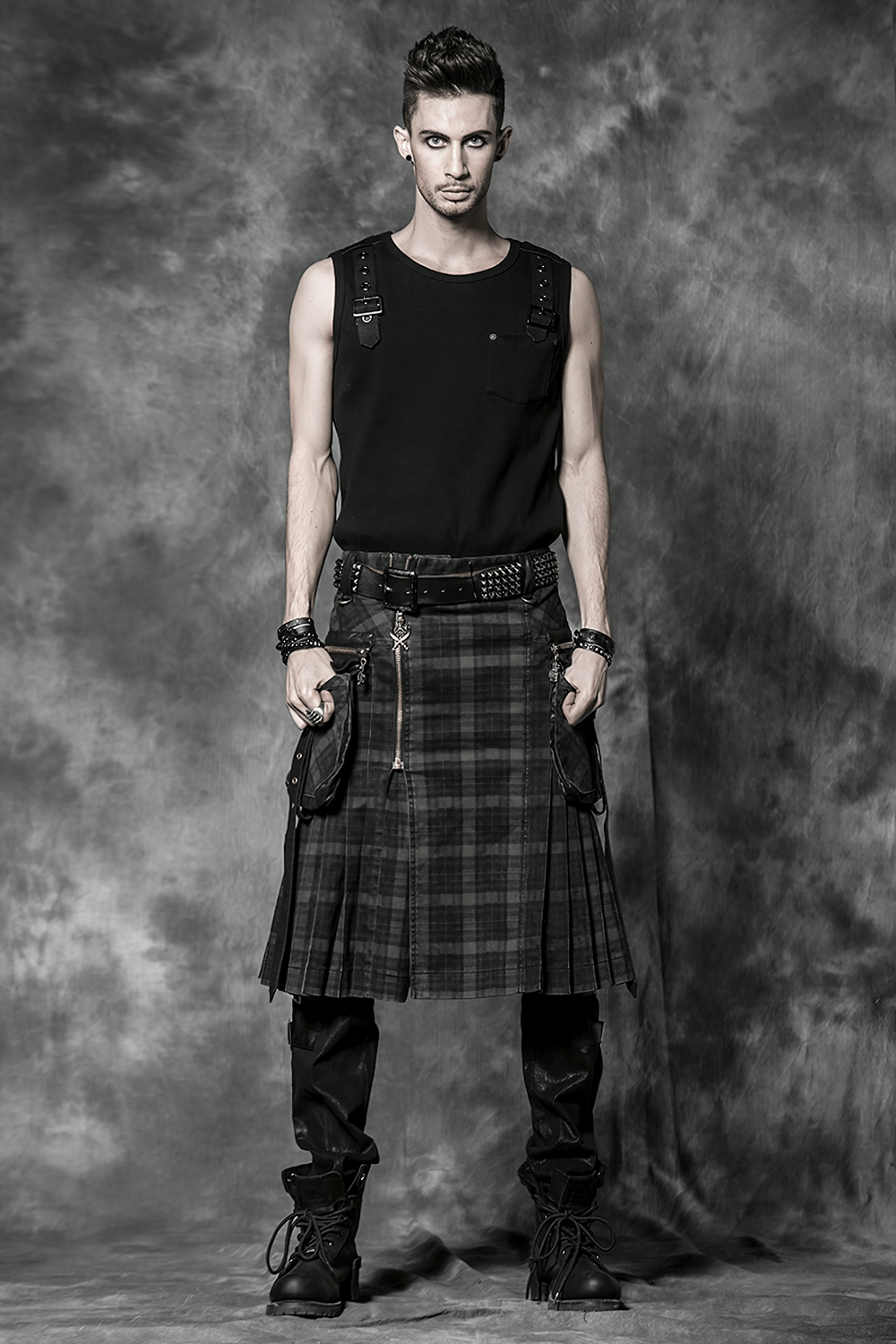 Men's punk plaid kilt with cargo pockets and zipper, showcasing an edgy, alternative style.