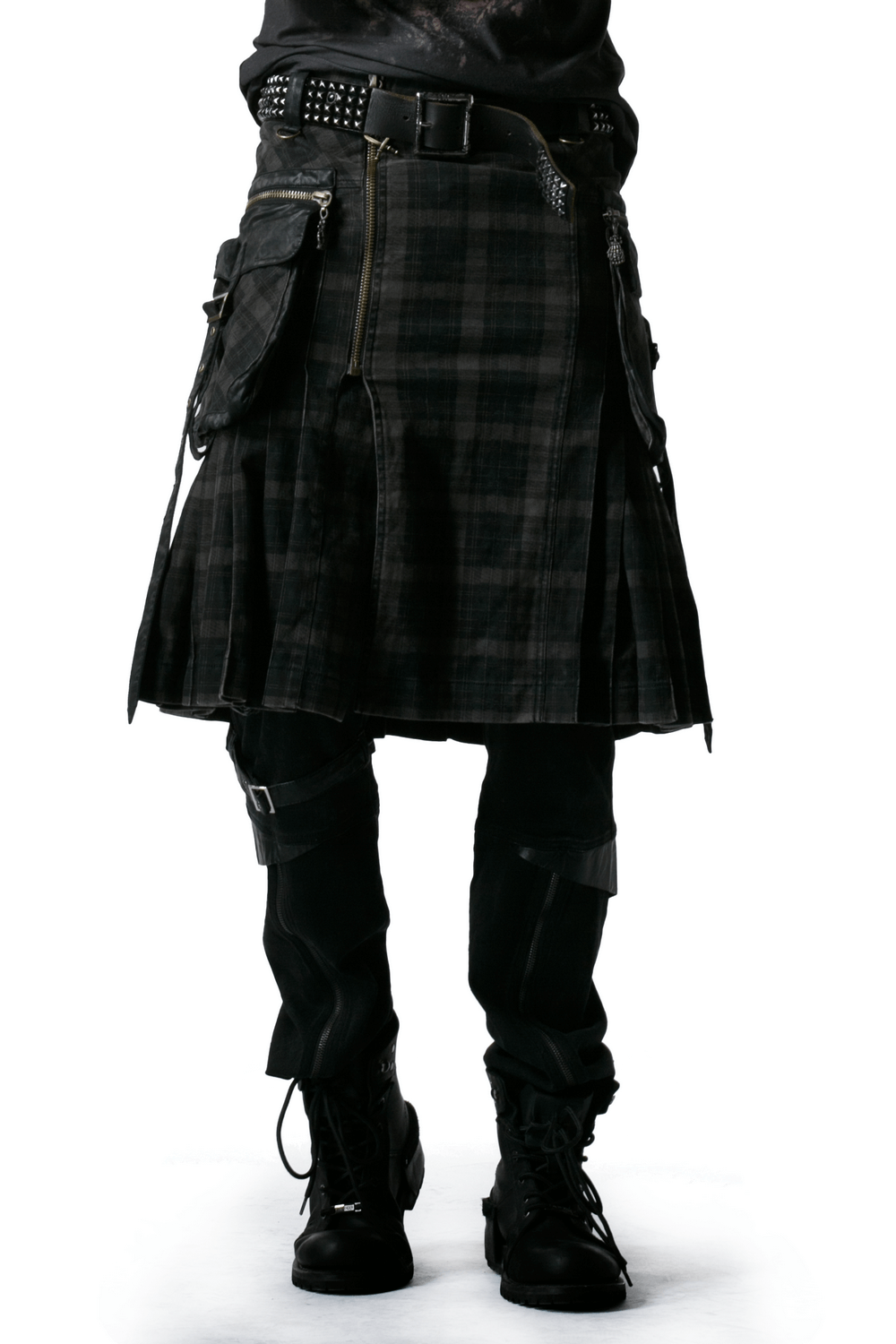 Men's punk black plaid kilt with cargo pockets and zipper closure, showcasing a bold alternative fashion statement.