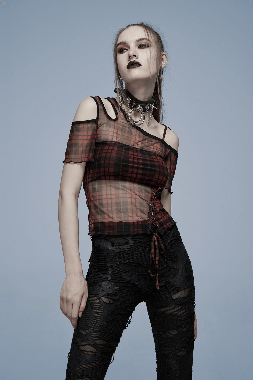 Punk plaid mesh off-shoulder women's T-shirt styled with edgy black ripped pants for a bold fashion statement.