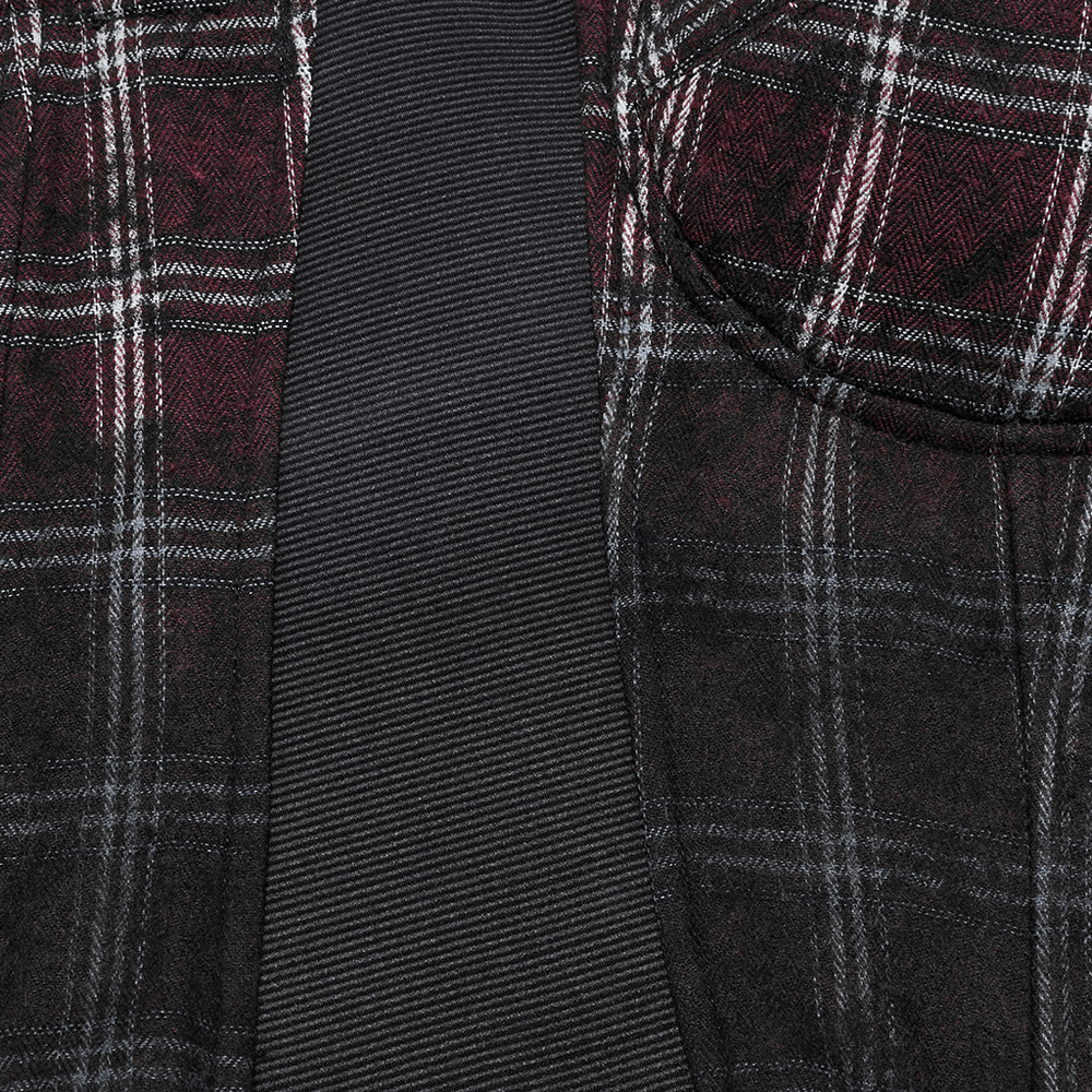 Close-up of punk plaid top featuring a gradient design and bold skull zipper details.