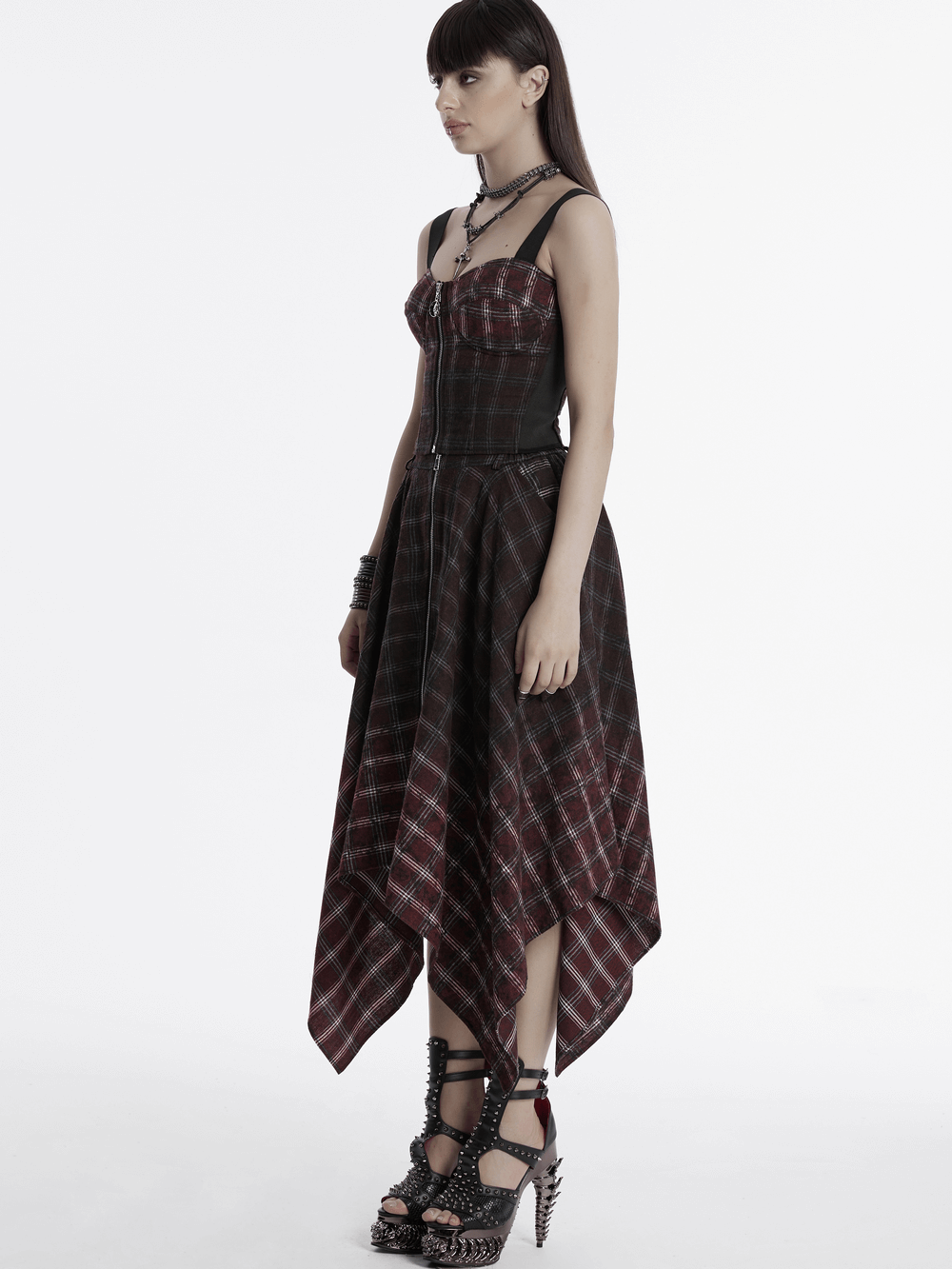 Model in a punk plaid top featuring a skull zipper and adjustable straps, showcasing edgy vintage style.