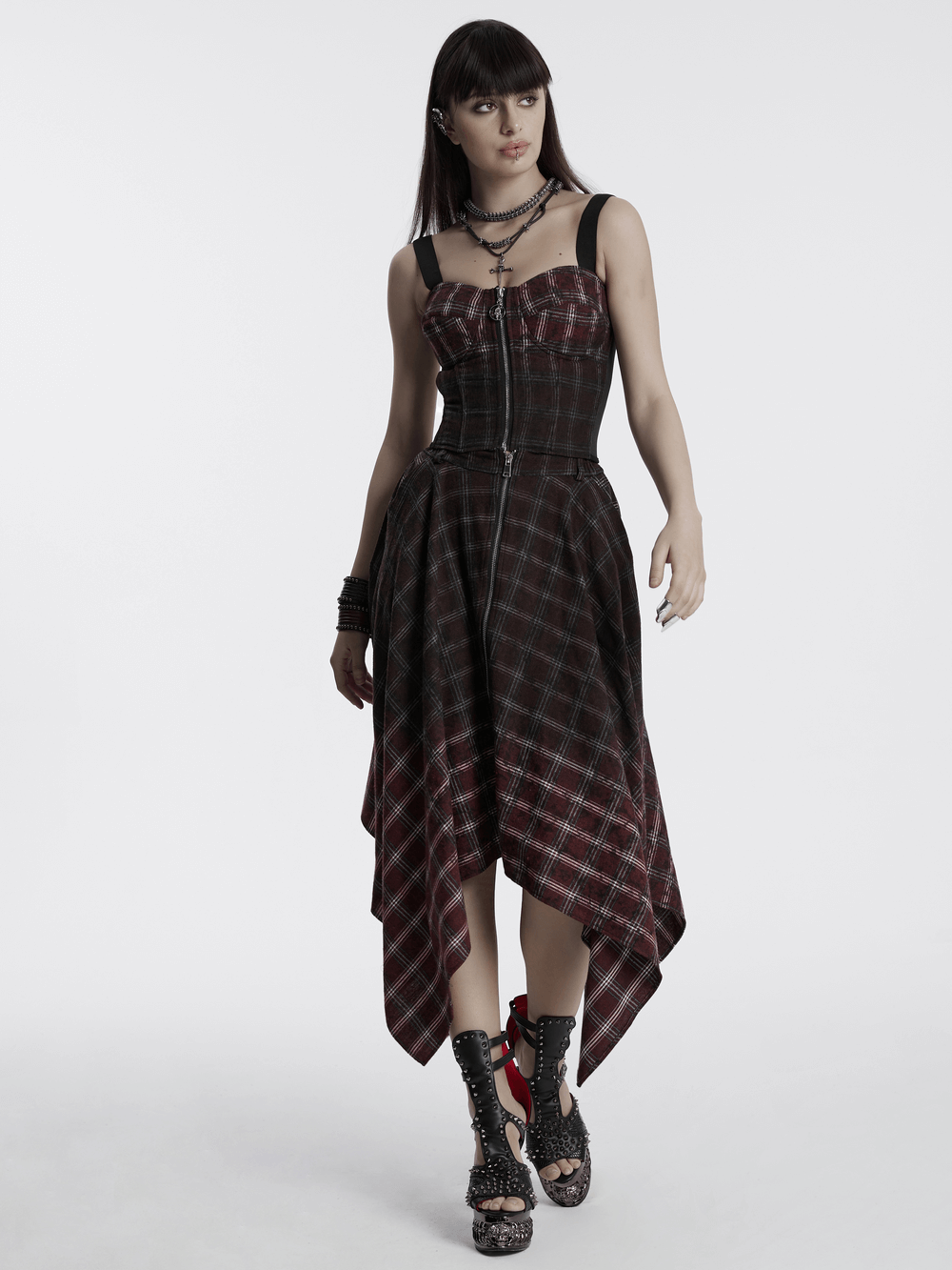 Punk plaid top with skull zipper and adjustable straps, showcasing a unique vintage style.