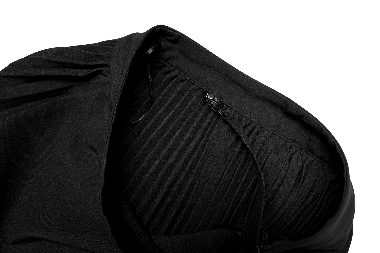 Close-up of the interior detailing of the punk pleated asymmetric skirt featuring subtle pleats and fastening.