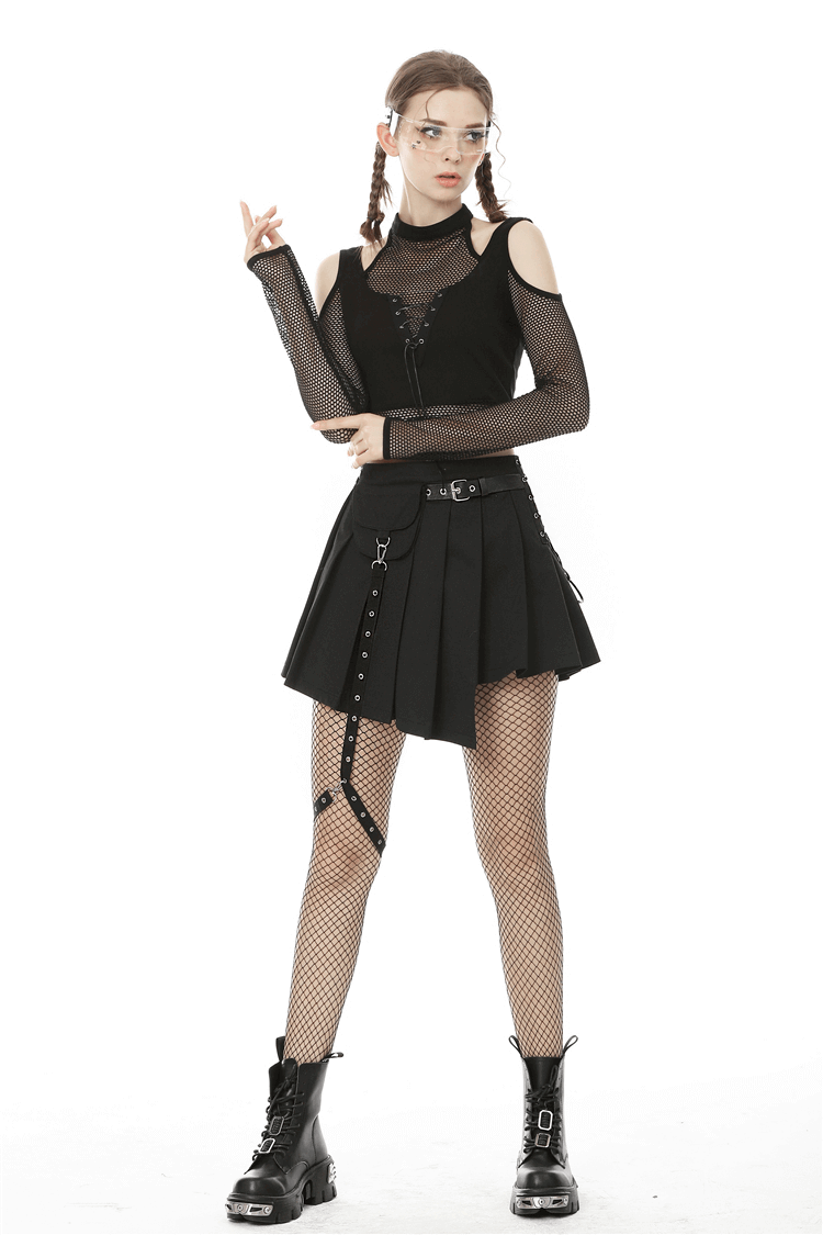 Edgy punk pleated mini skirt with pocket and leg belt, styled with mesh top and fishnet stockings.