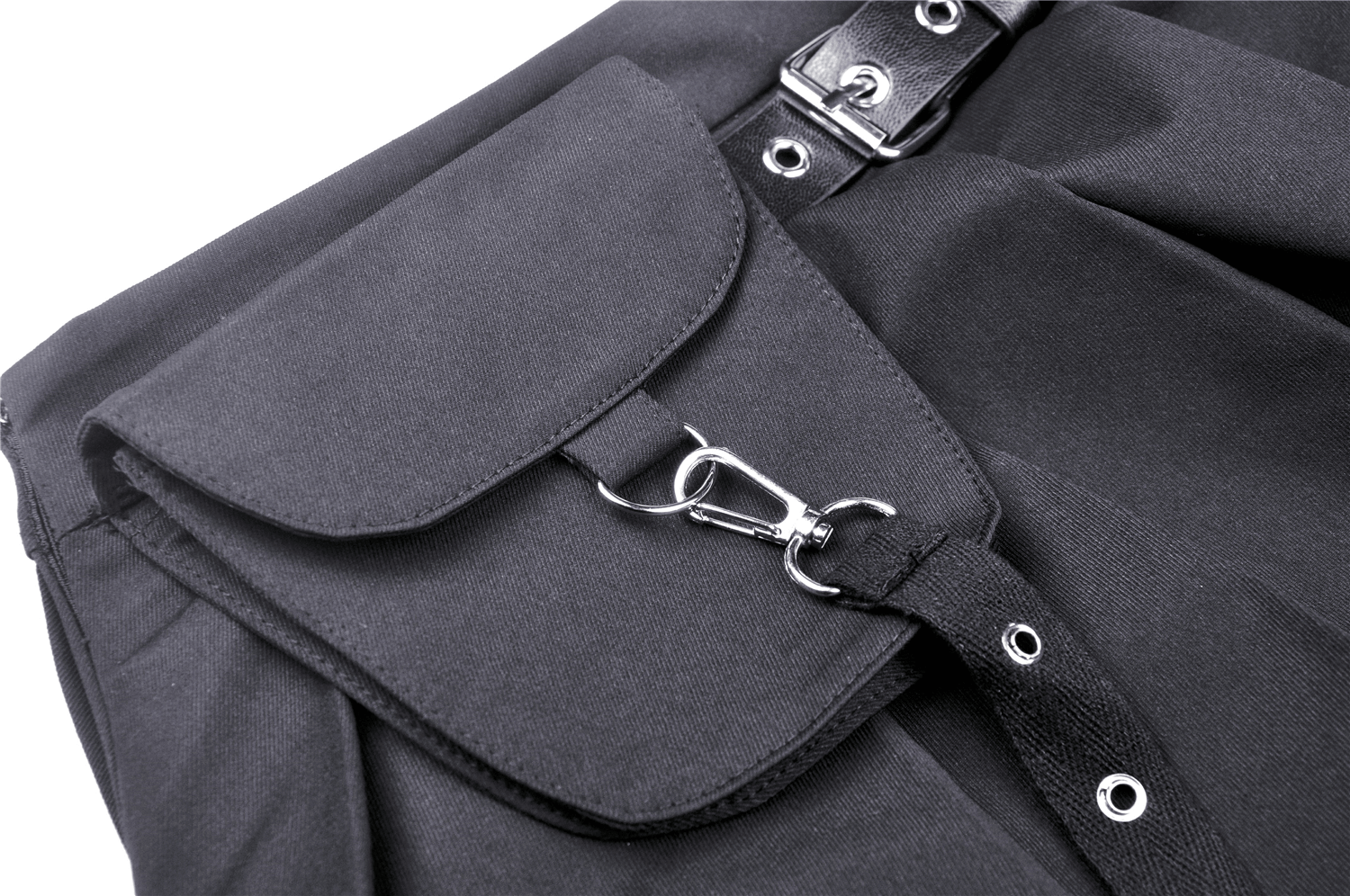 Close-up of punk pleated mini skirt pocket and leg belt, showcasing edgy black fabric and metal hoop details.