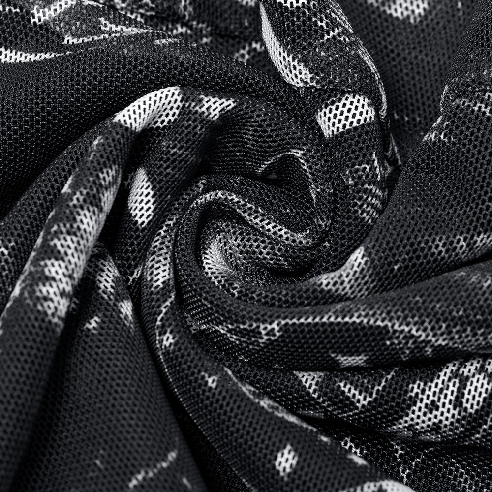 Close-up of black and white gothic skeleton print fabric, showcasing its mesh texture and edgy design for leggings.