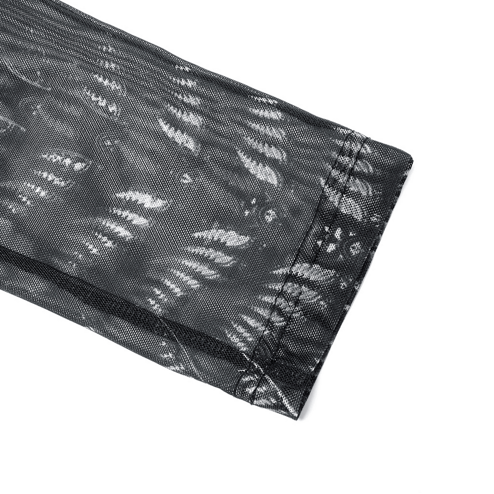 Close-up of black mesh fabric with intricate white skeleton print design for punk rave leggings.