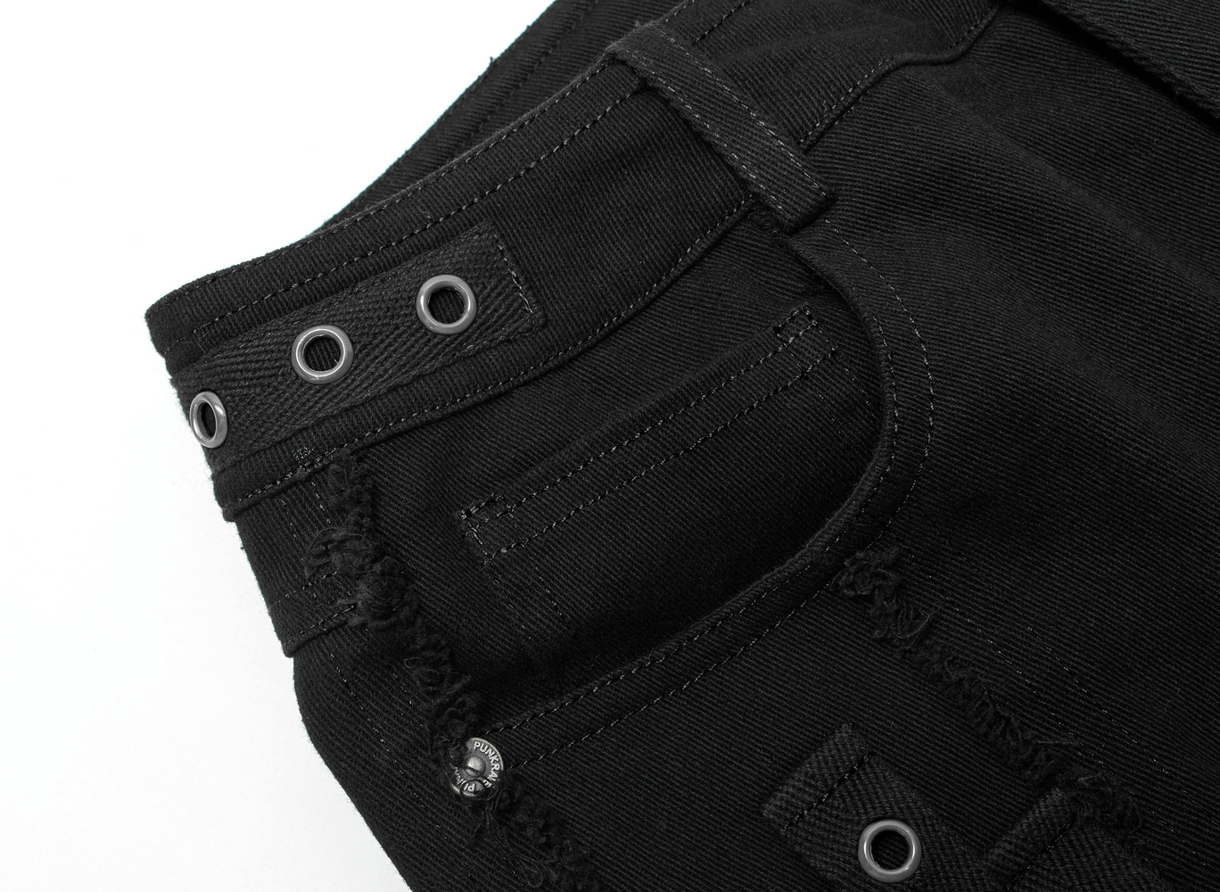 Close-up of punk rave black denim shorts featuring edgy studs and lace detailing for a gothic aesthetic.