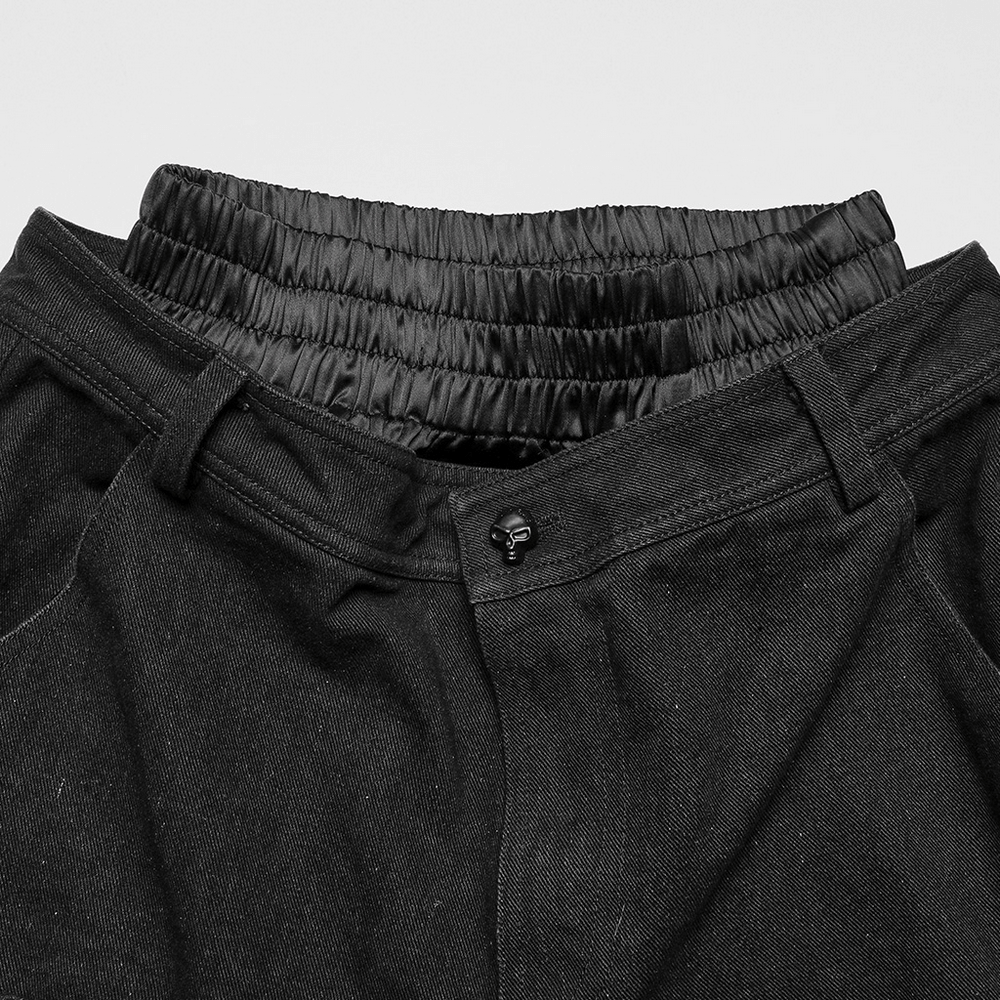 Close-up of Punk Rave black distressed wide-leg denim pants with elastic waist and engraved button detail.