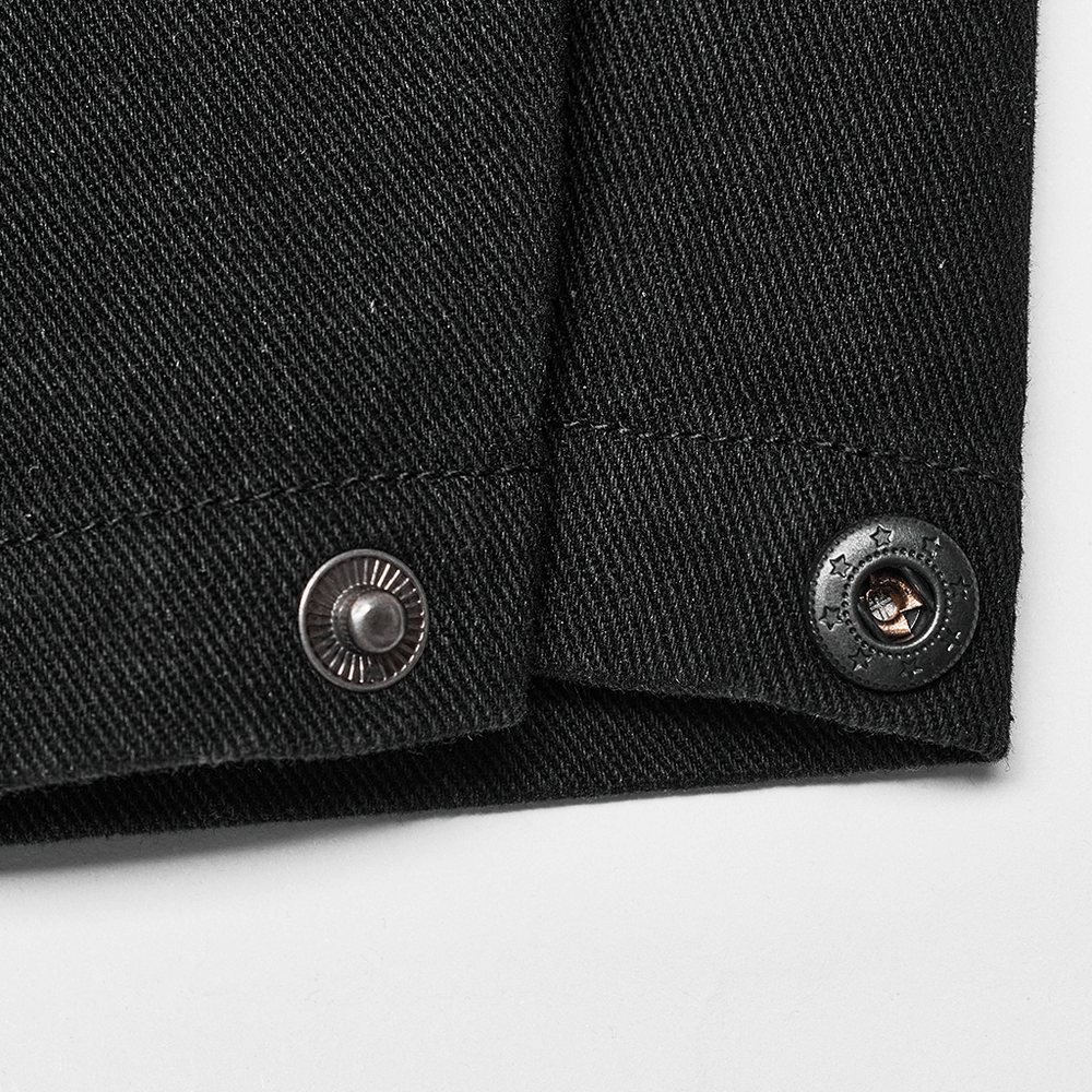 Detail of Punk Rave black distressed denim pants showing engraved buttons for adjustable fit.