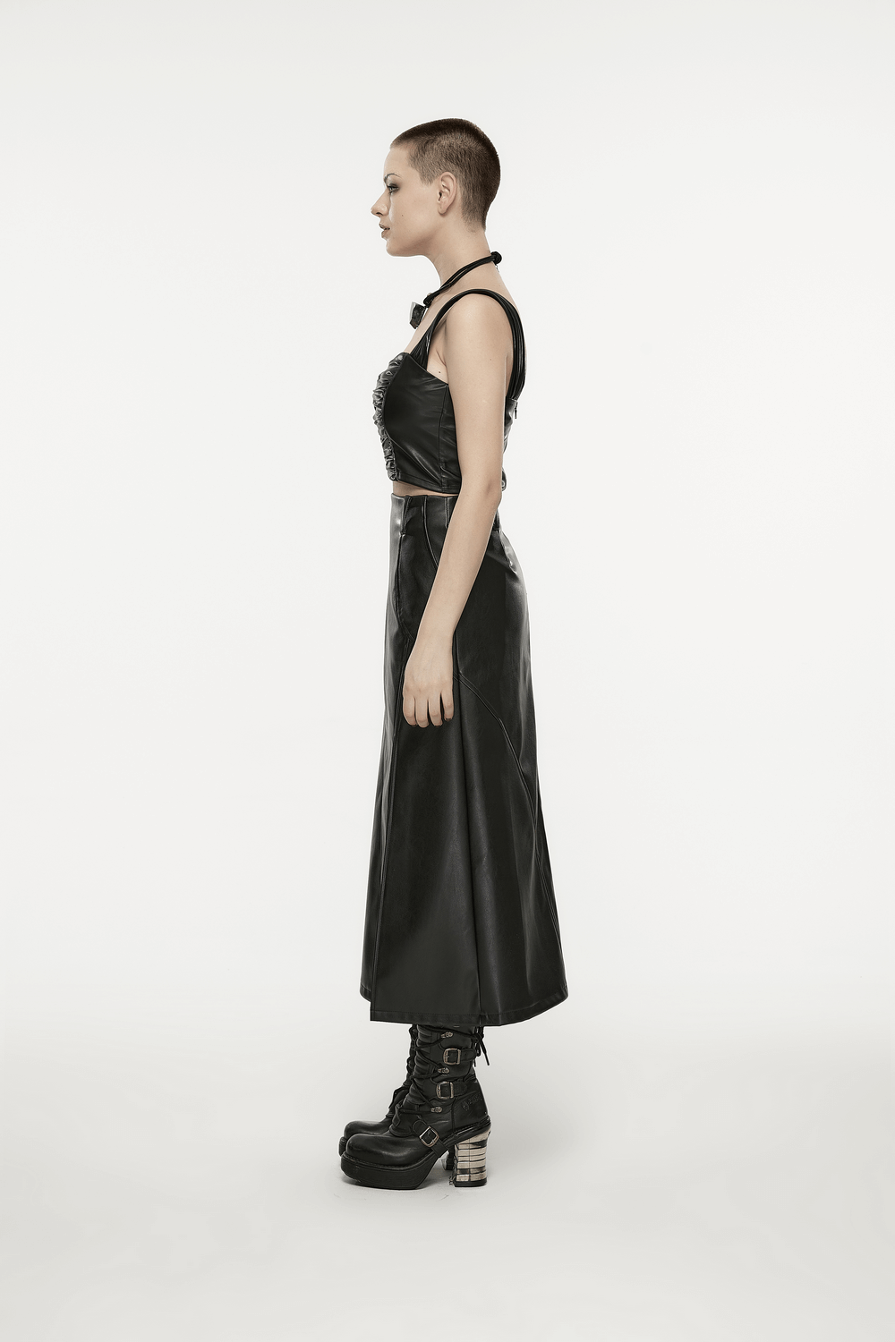 Model showcasing Punk Rave black faux leather high waist A-line split skirt from the side, exuding edgy fashion vibes.