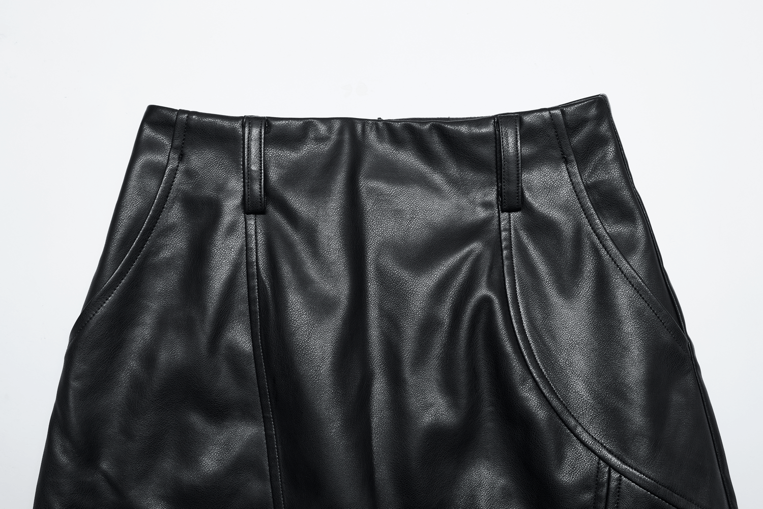 Close-up of Punk Rave black faux leather high waist skirt showing the textured fabric and tailored details.