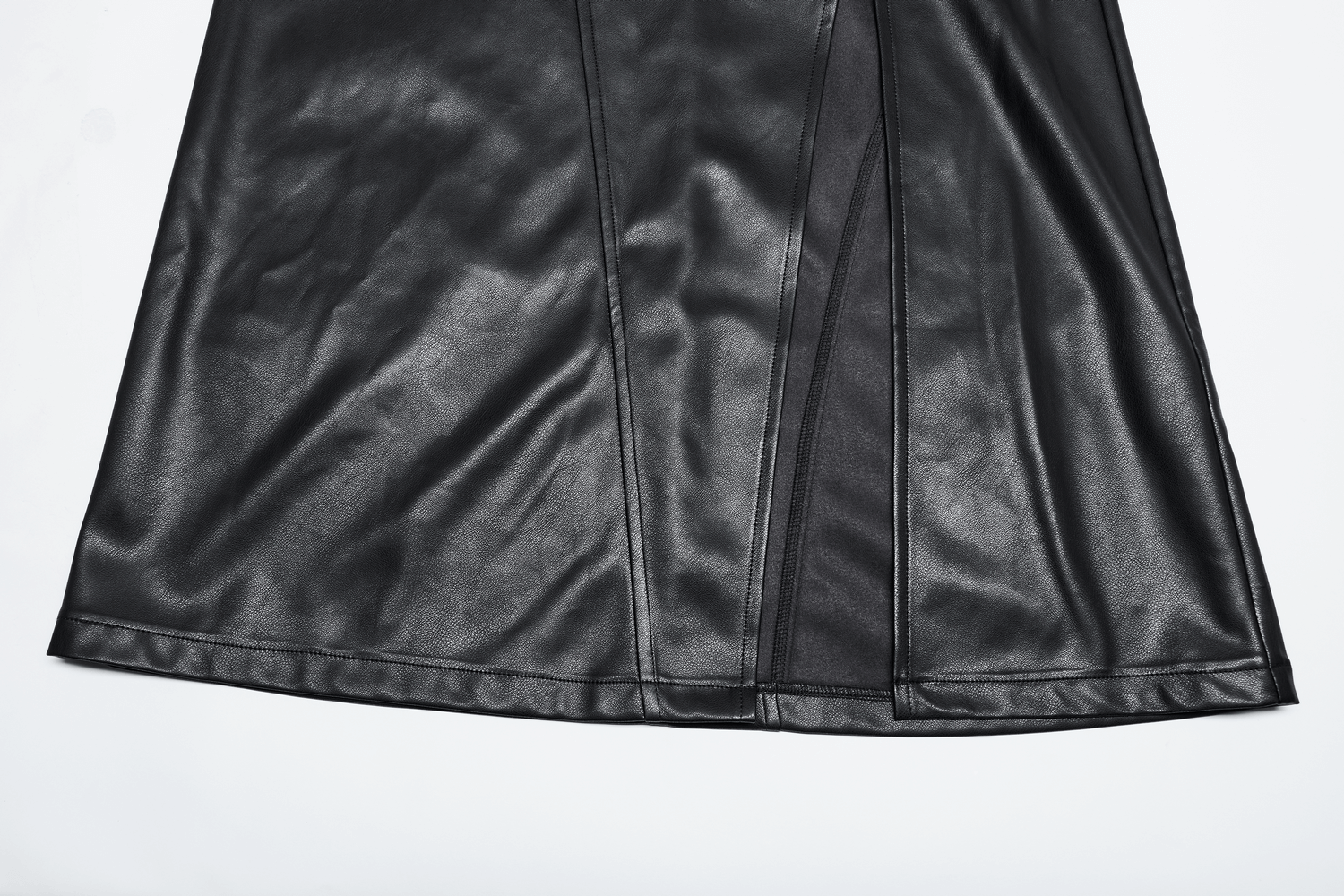 Close-up of a black faux leather high waist A-line split skirt, showcasing sleek texture and dramatic side slit.