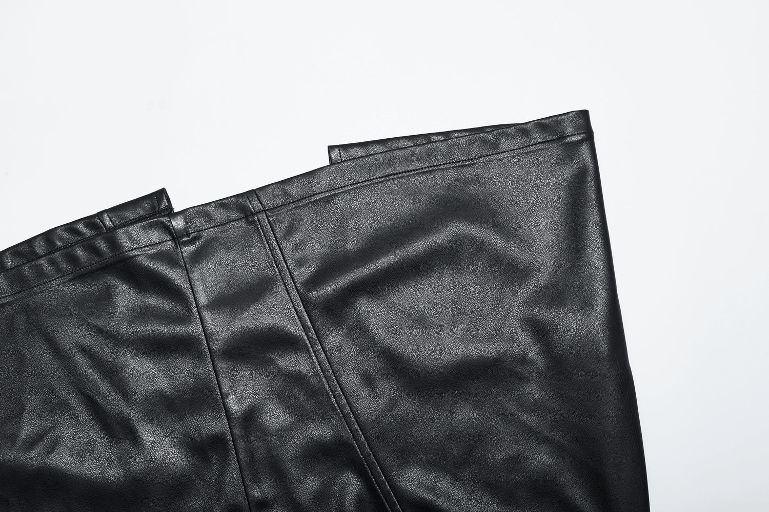 Black faux leather high waist A-line skirt with a dramatic side slit and invisible zipper detail.