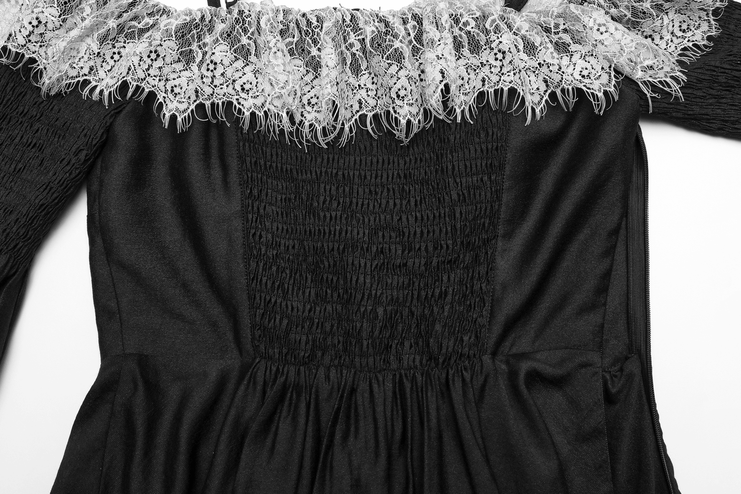 Close-up of the lace neckline and smocked bodice of a black Gothic off-shoulder mini dress.