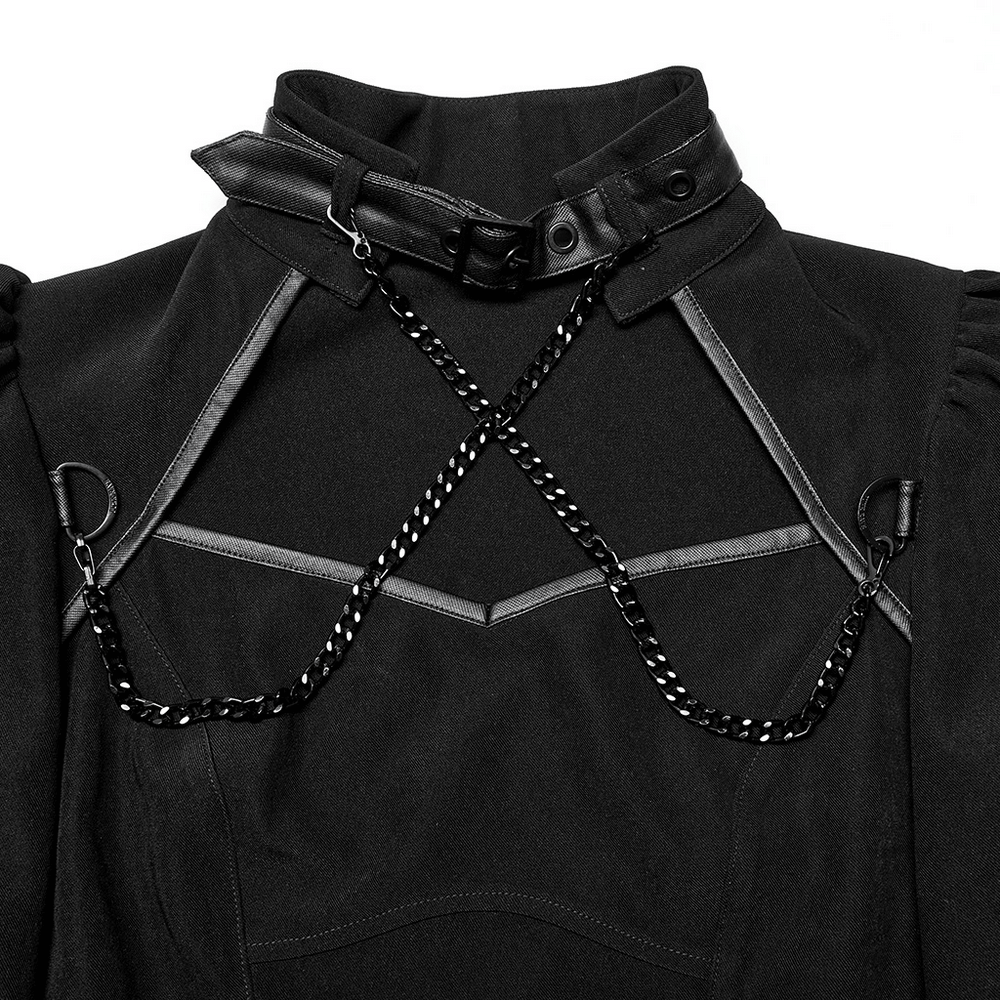 Close-up of a black gothic techwear dress featuring adjustable high collar, faux leather trim, and detachable chain