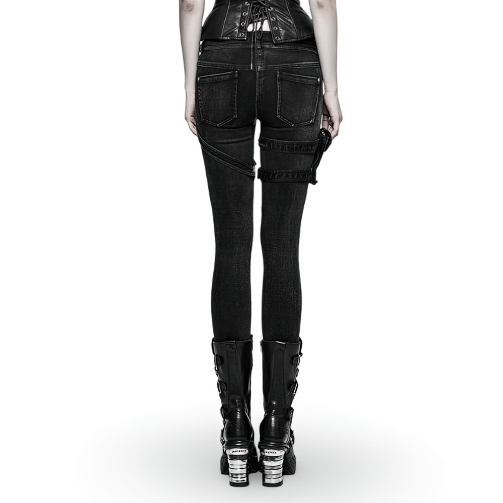 Back view of Punk Rave black grunge skinny jeans featuring edgy grommet pockets and a vintage washed look.