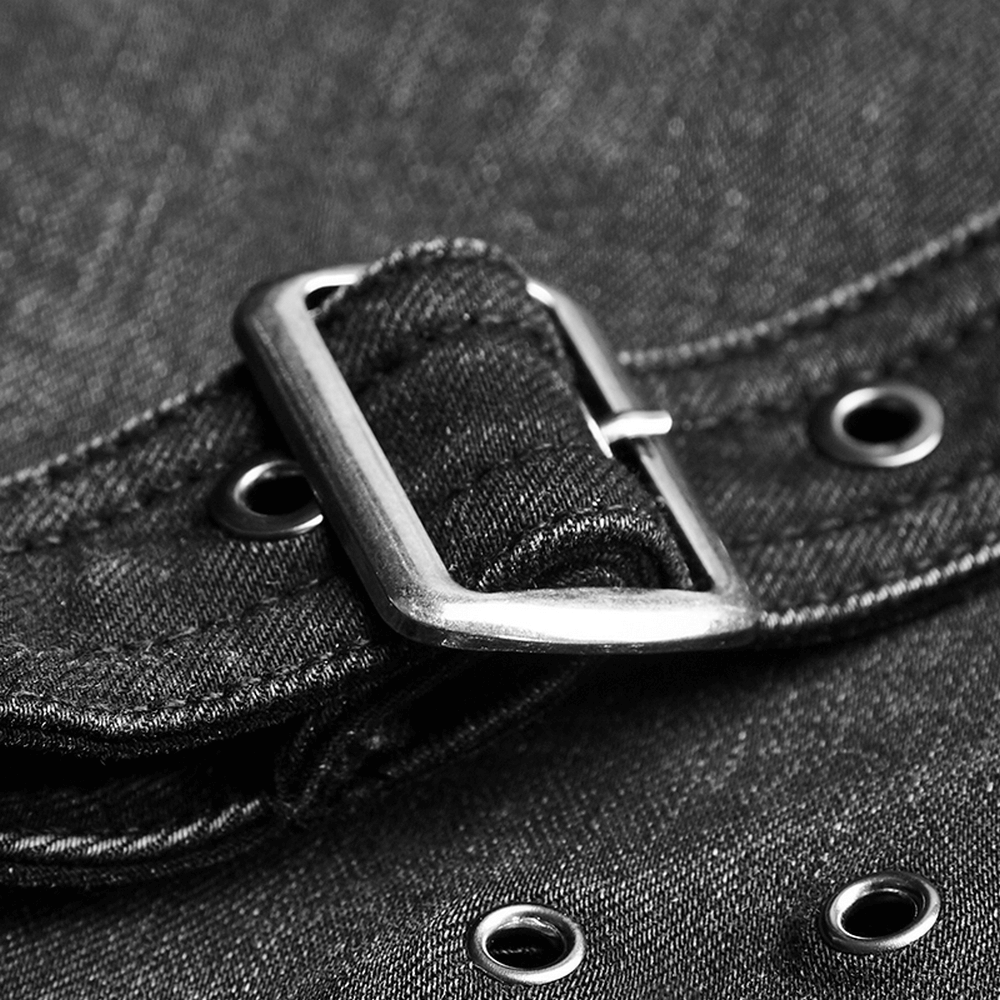 Close-up of black grunge jean buckle and eyelets, showcasing punk-inspired style and edgy design.