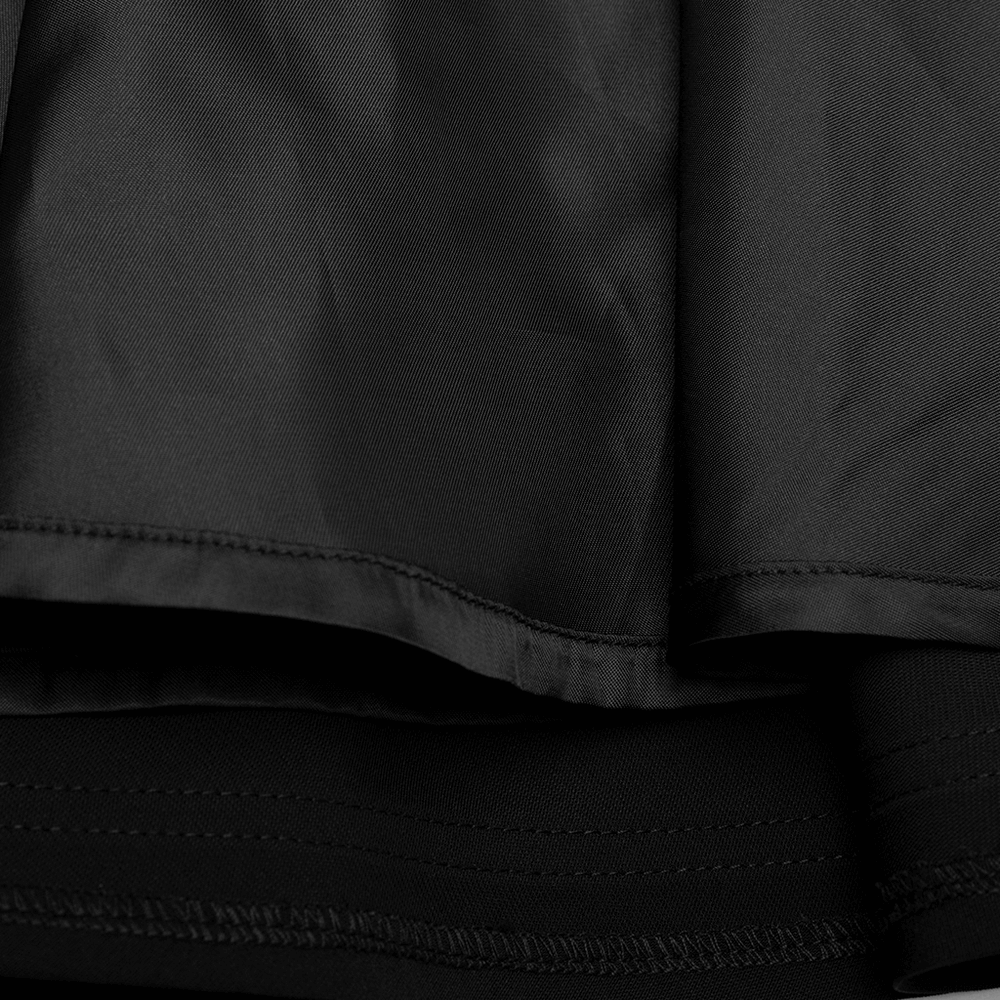Close-up of the sleek black fabric of the Punk Rave high-waisted skirt highlighting its smooth texture and elegant finish.