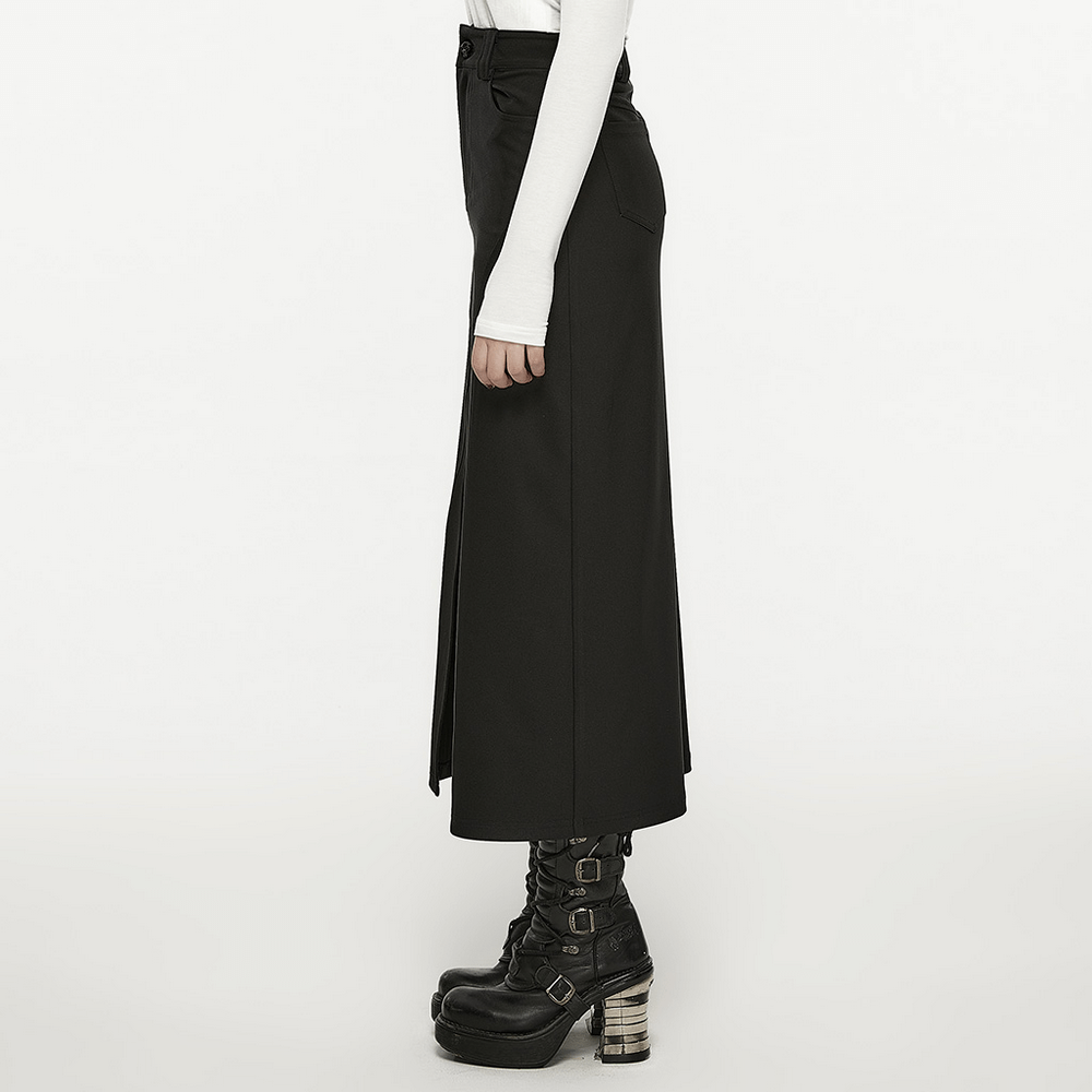 Side view of a black A-line midi skirt with V-cut front slit, paired with edgy black platform boots.