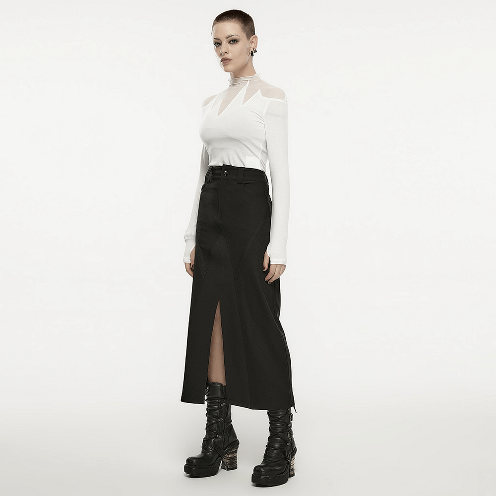 Model showcases a black V-cut front slit A-line midi skirt with a dramatic look, perfect for punk-inspired outfits.