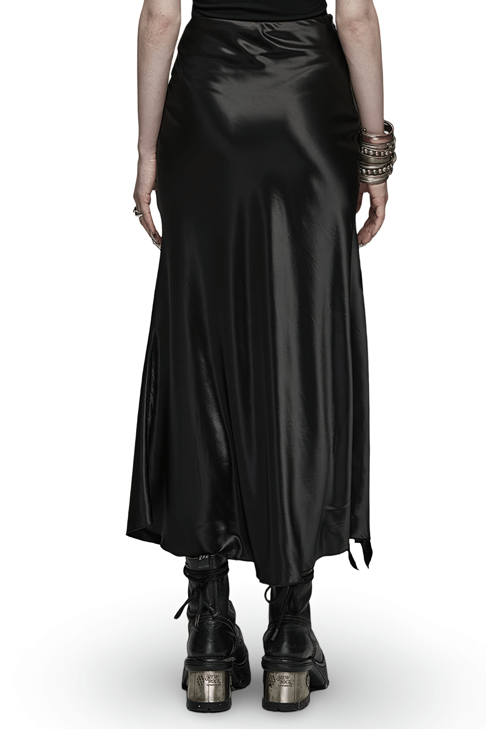 Back view of Punk Rave Gothic Black A-Line Draped Skirt with asymmetrical ruffles and stylish ankle boots.