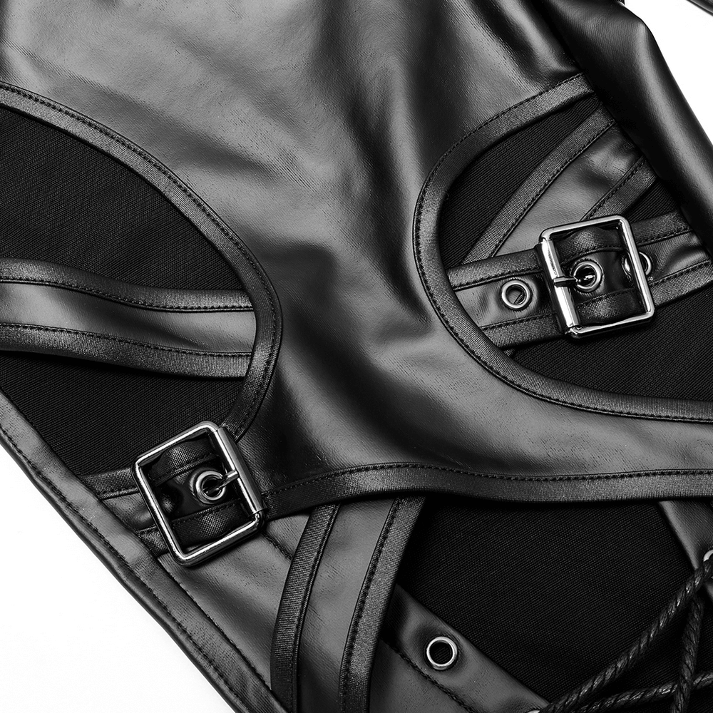 Close-up of detailed black faux leather with buckle accents and mesh in punk rave style.