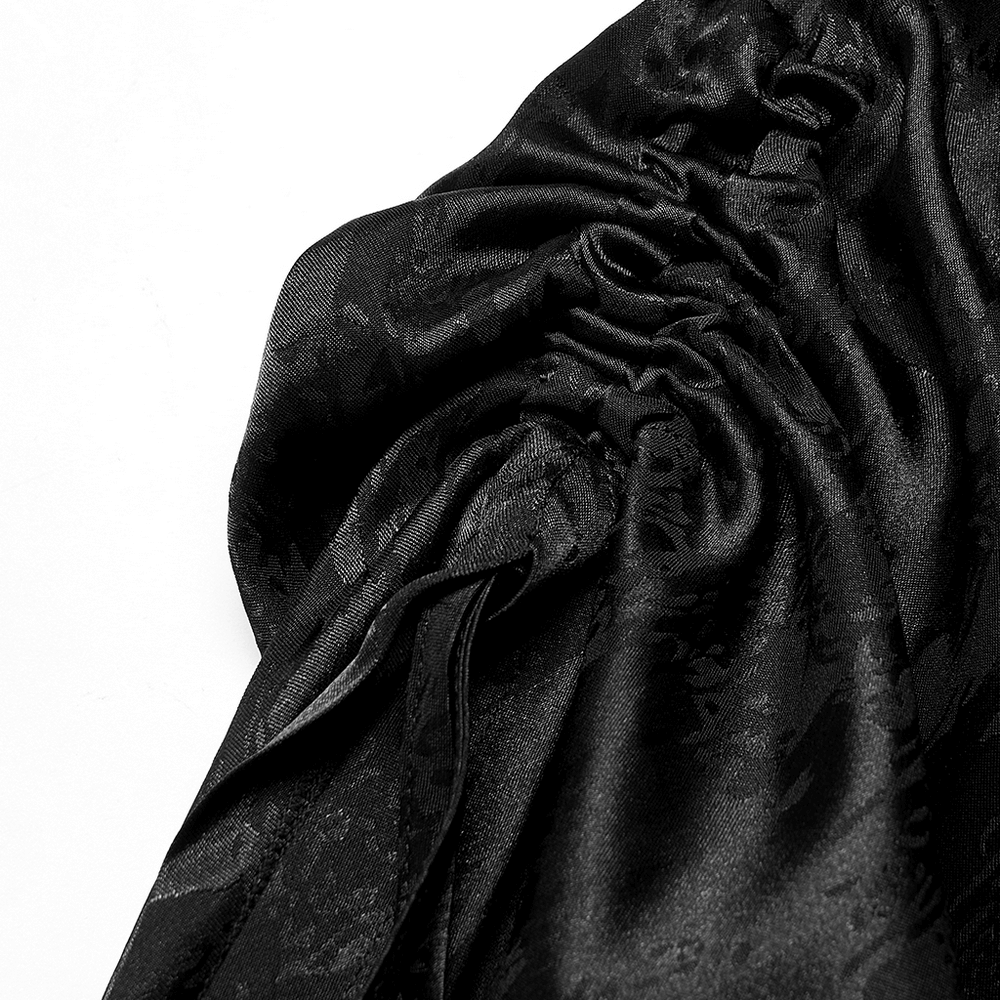 Close-up of luxurious black fabric showcasing the gathered texture of a Gothic cheongsam dress.