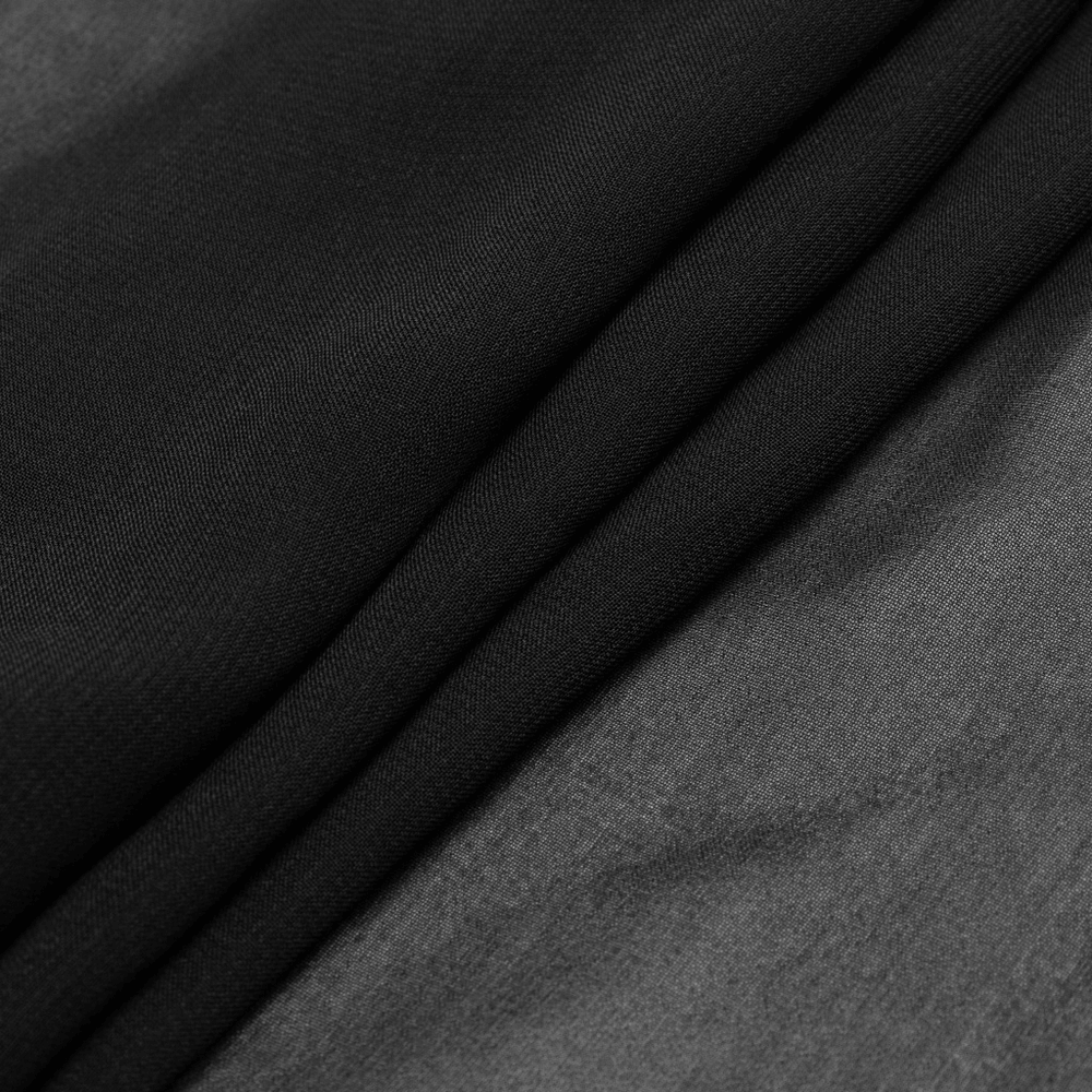 Close-up of black and gray fabric layers, perfect for gothic fashion like Punk Rave dresses.