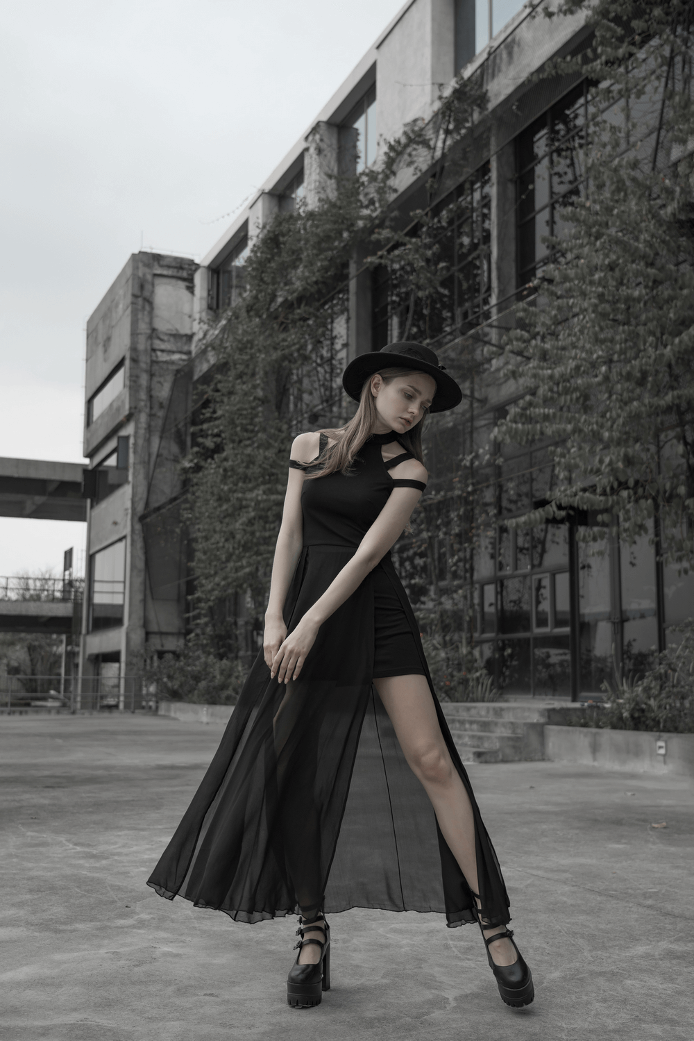 Punk Rave Gothic dress with flowing chiffon skirt and crescent moon embroidery in modern urban setting.