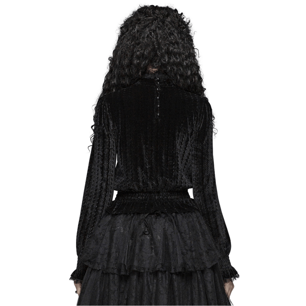 Back view of a gothic black velvet blouse with ruffle collar and elastic cuffs, showcasing its luxurious design.