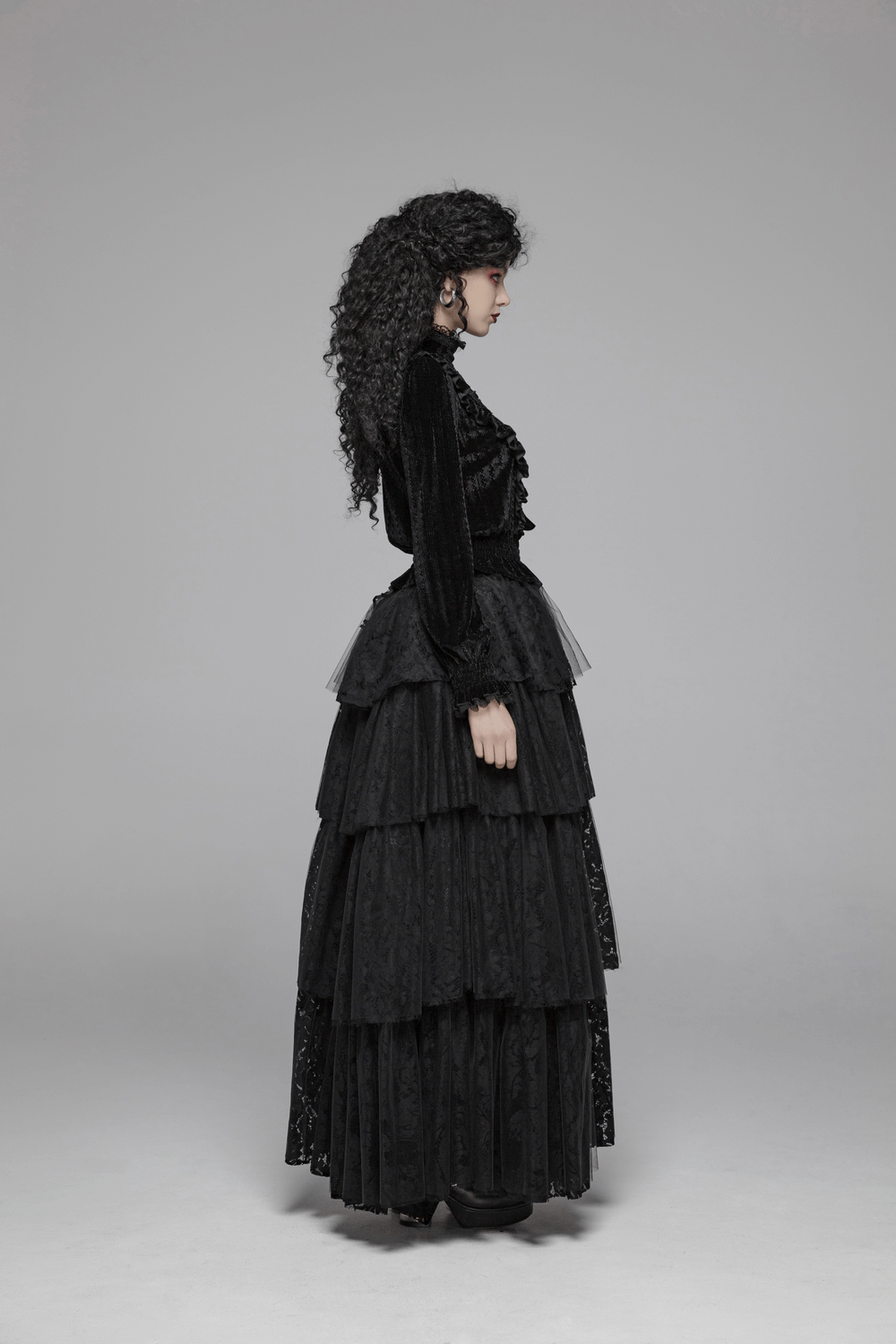Punk Rave Gothic black velvet blouse with ruffle collar and layered skirt in a dramatic side view.