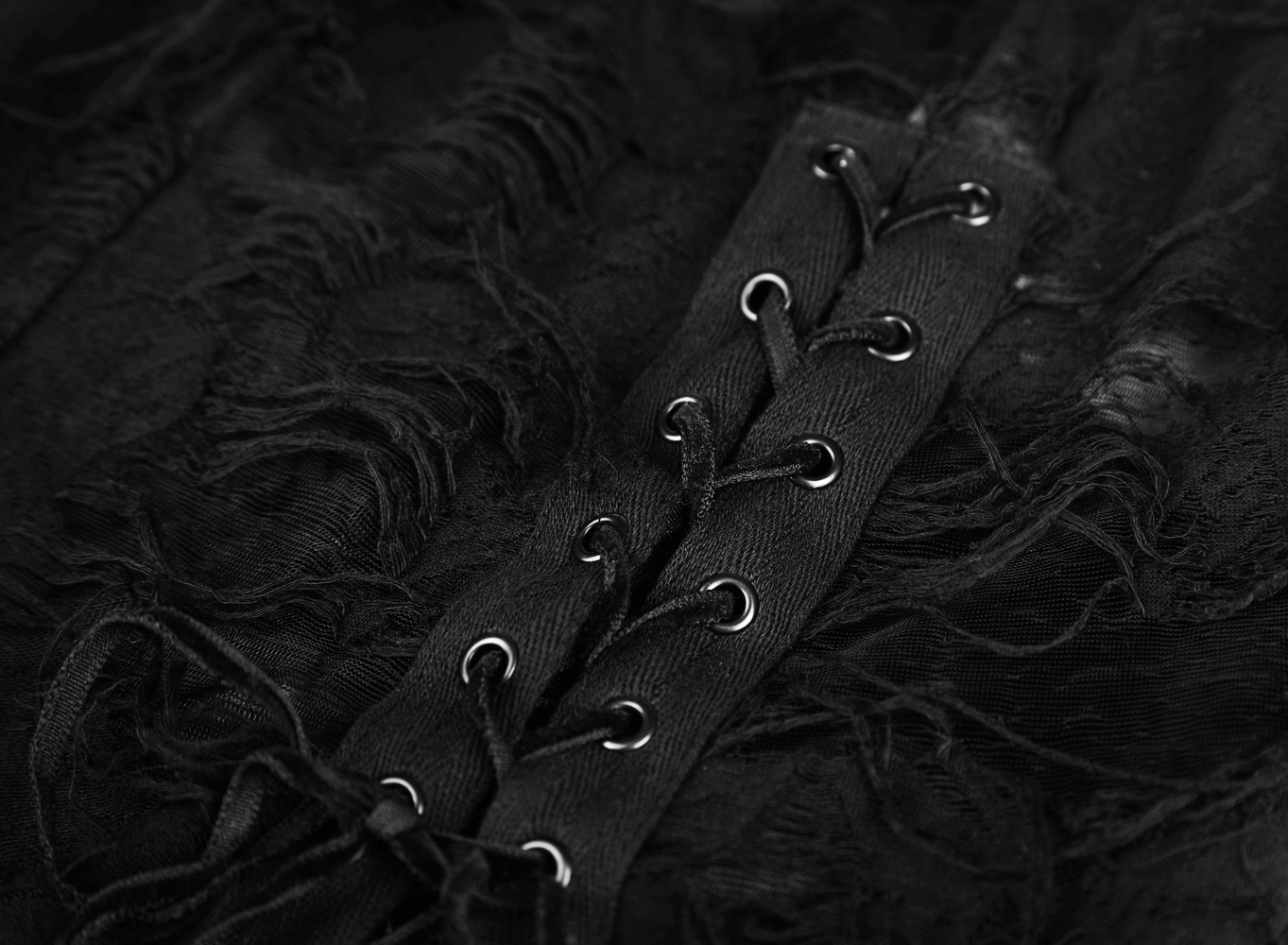 Close-up of the lace-up detailing on Punk Rave Gothic Lace Rope Dress, showcasing its dark, textured fabric.