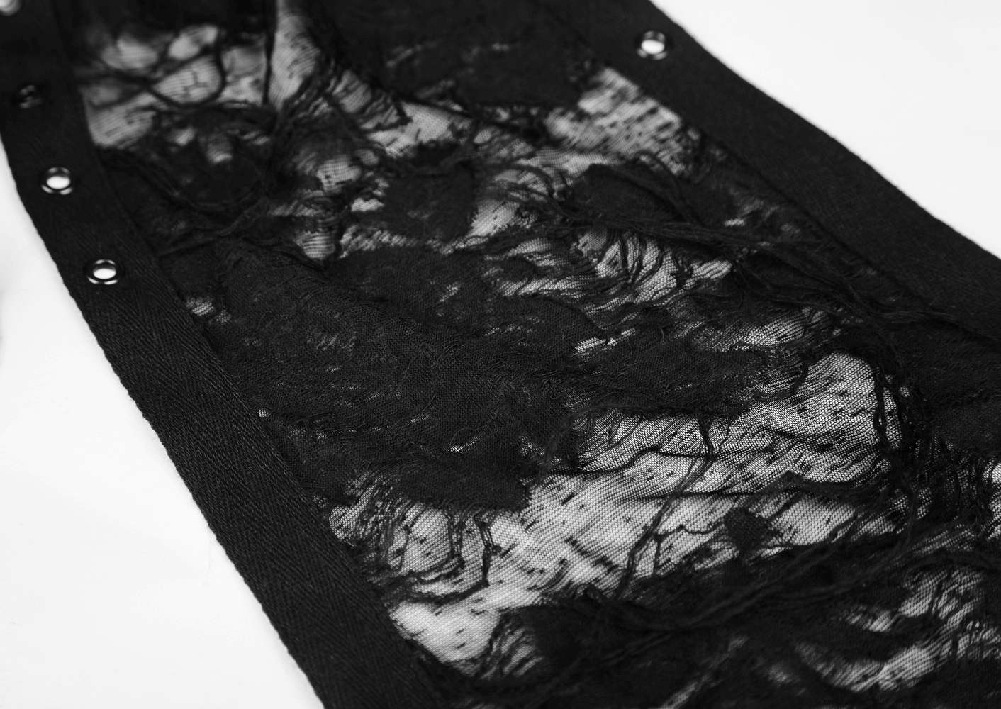Close-up of the black mesh lace fabric with intricate details, perfect for a gothic style dress.