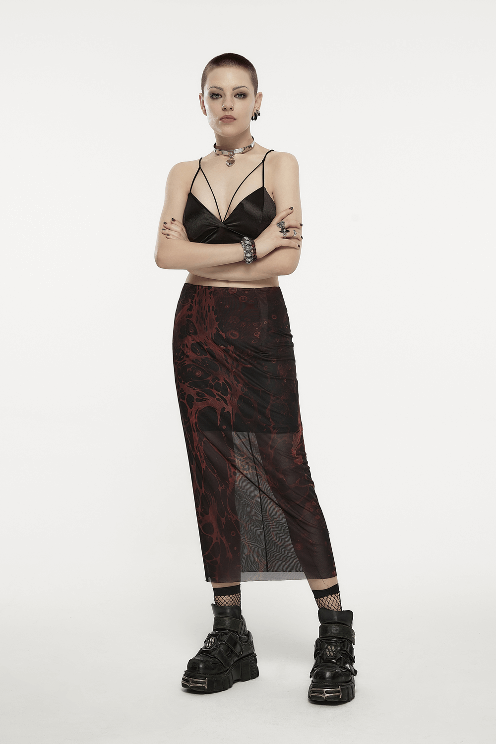 Model wearing Punk Rave Gothic Lava Midi Skirt with edgy black top and chunky boots, showcasing a striking irregular pattern.