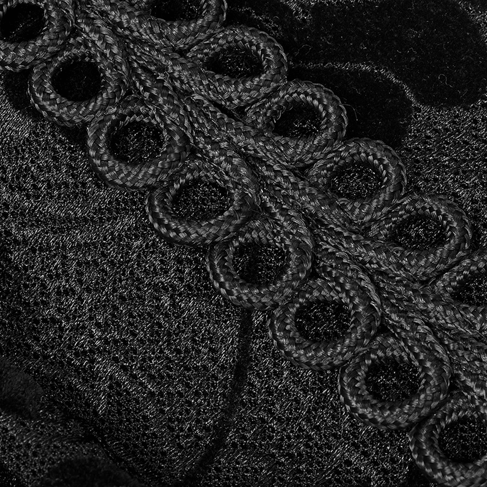 Close-up of intricate black lace detailing on a Gothic Lolita kimono dress, showcasing elegant design elements.