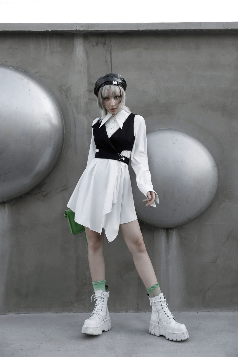 Model in a Punk Rave Gothic White Swallowtail Shirt Dress with asymmetrical hem and chunky boots.