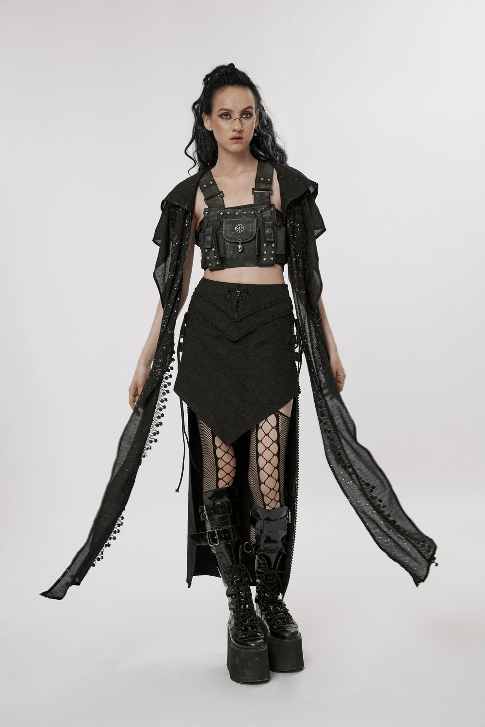 Model in a Punk Rave high-low jacquard skirt with edgy accessories and gothic-inspired footwear.