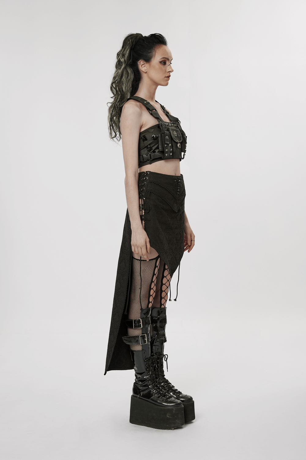 Edgy model showcasing Punk Rave's high-low asymmetrical jacquard skirt with gothic-inspired elements and stylish accessories.