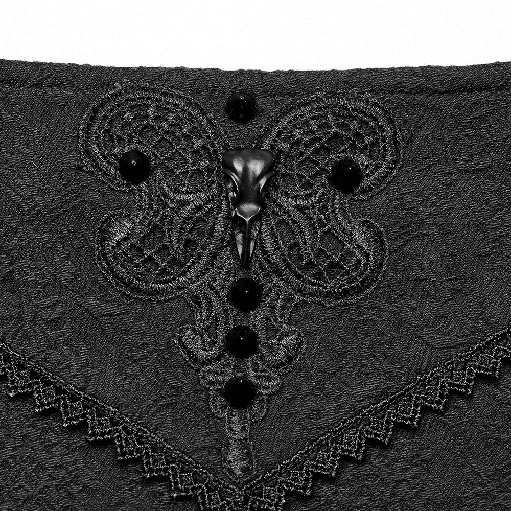Close-up of intricate black butterfly lace detail on Punk Rave skirt with decorative buttons.