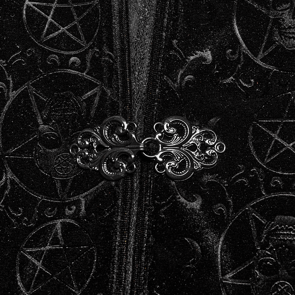 Close-up of the intricate pentagram buckle on a black velvet cape, showcasing gothic style and embossed designs.