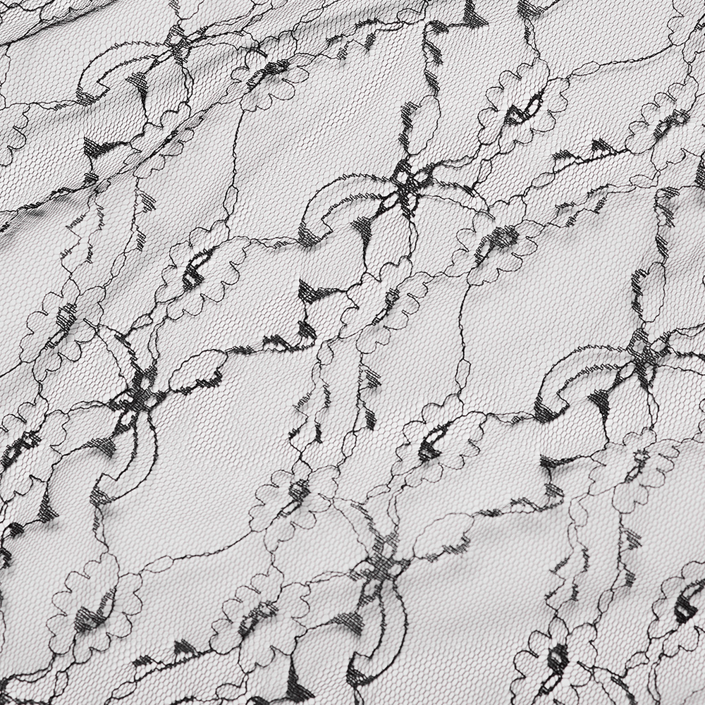 Close-up of delicate black lace fabric featuring floral patterns, perfect for gothic and elegant apparel.
