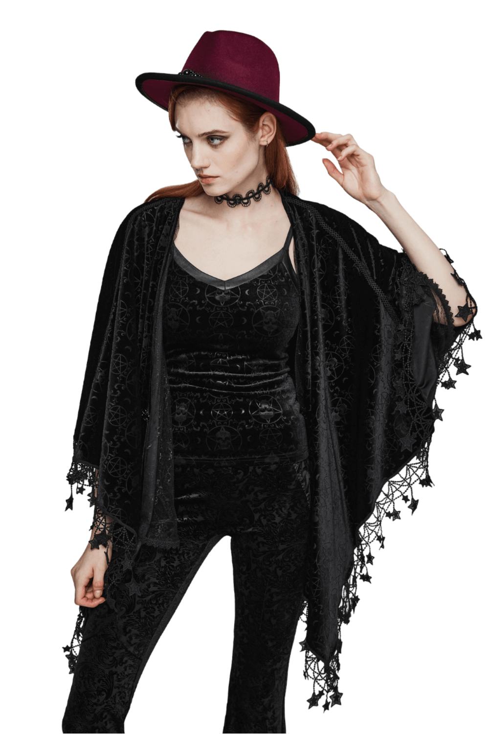 Gothic woman in velvet cape with pentagram tassels, paired with a dark hat and choker, embodying sorceress style.