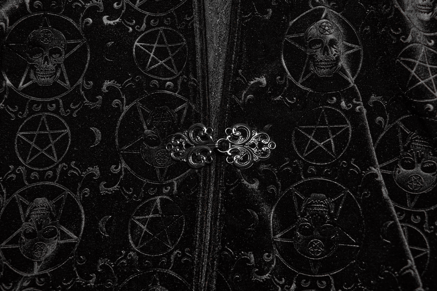Close-up of Punk Rave Occult Pentagram Cape featuring skull and pentagram design with intricate buckle detail.