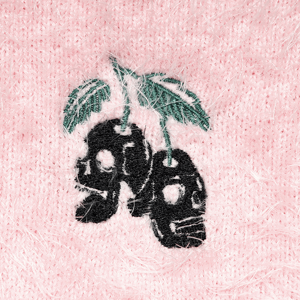 Cherry skull embroidery on soft pink faux fur sweater fabric, adding punk flair and unique style.